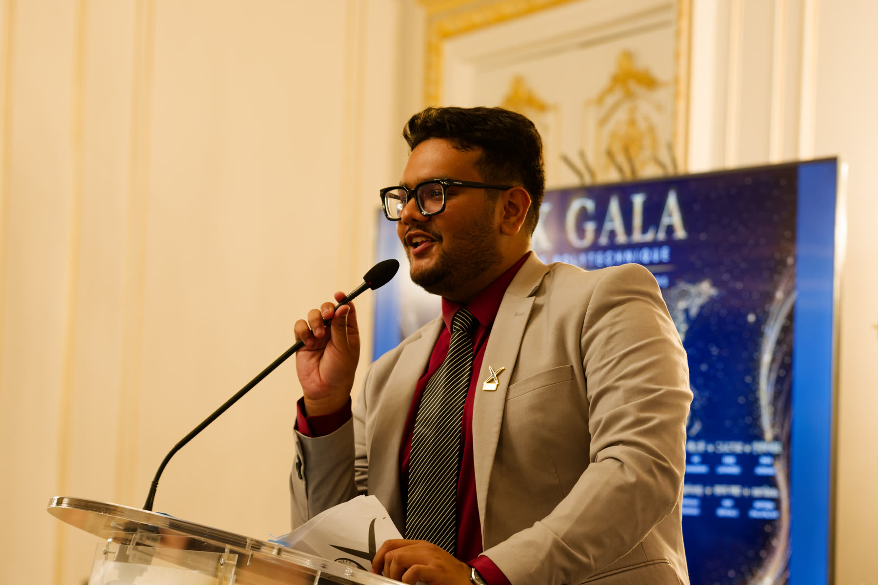 Prakhar Tiwari speaking at the École Polytechnique Gala